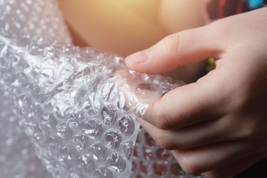 Child 039 S Hands Popping The Bubbles In Bubble Wrap